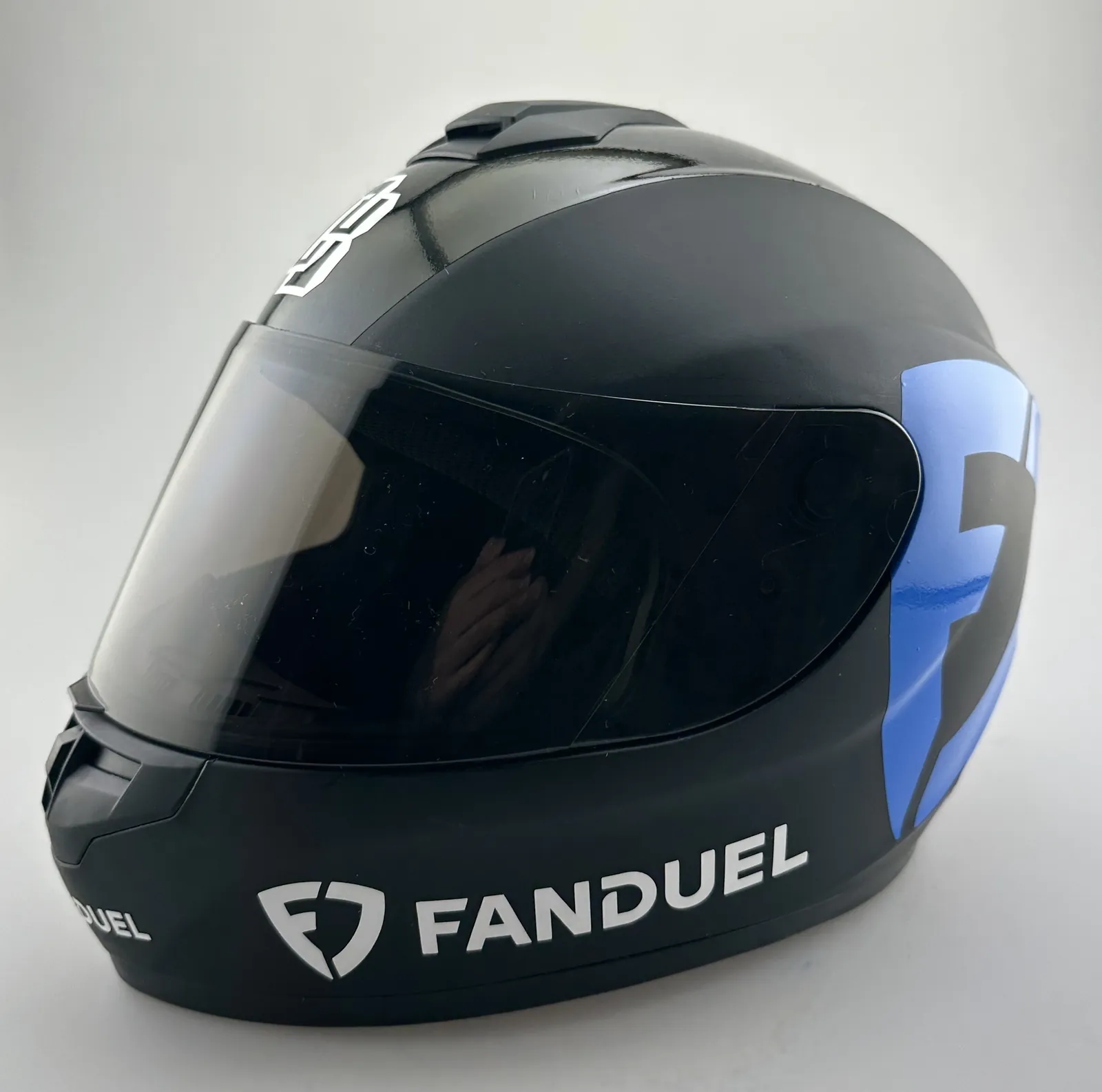 Black helmet with blue and white FanDuel graphics